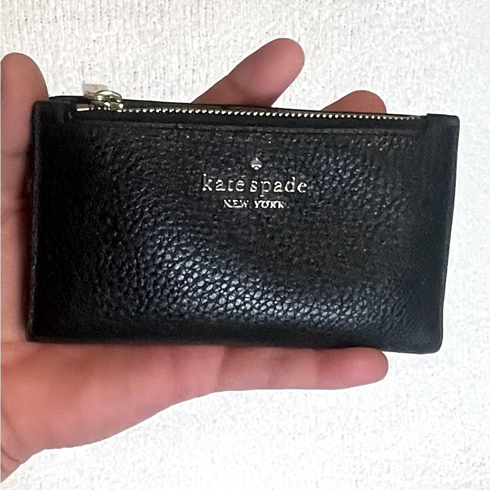 KATE SPADE - NEVER USED. Small wallet fits smaller crossbody or pocket.